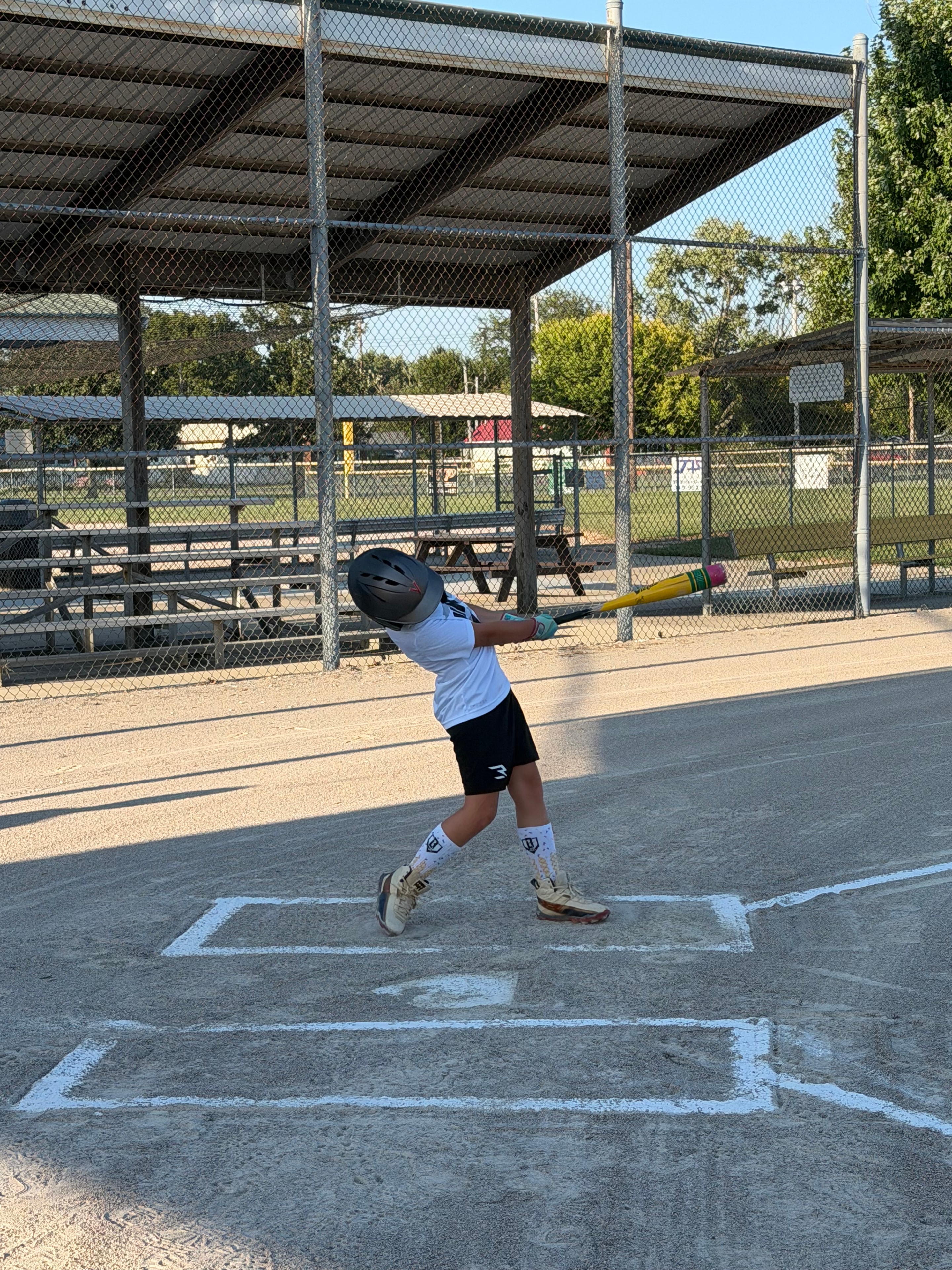 Velocity player taking swings during batting practice