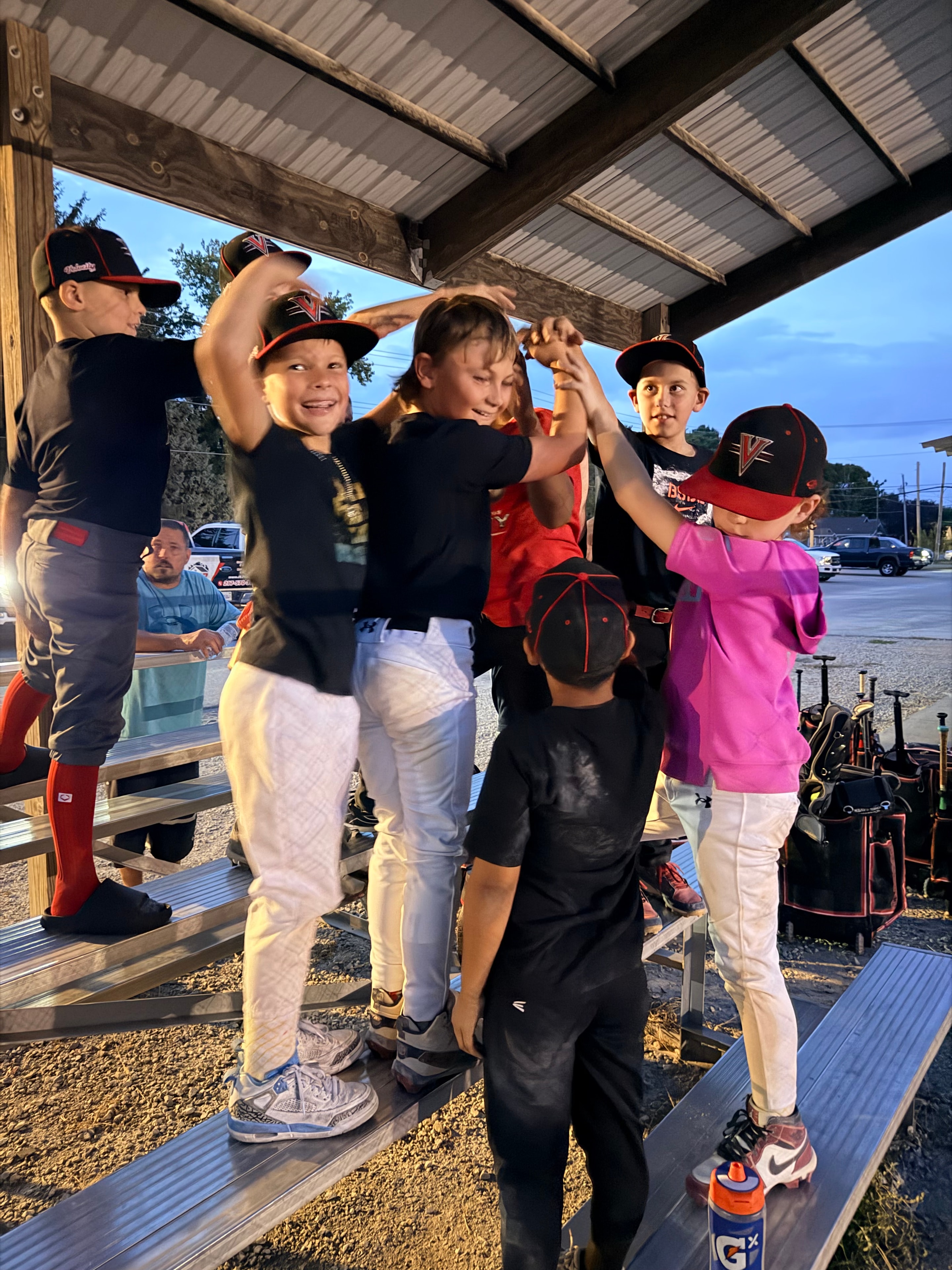 Velocity players celebrating on the bleachers